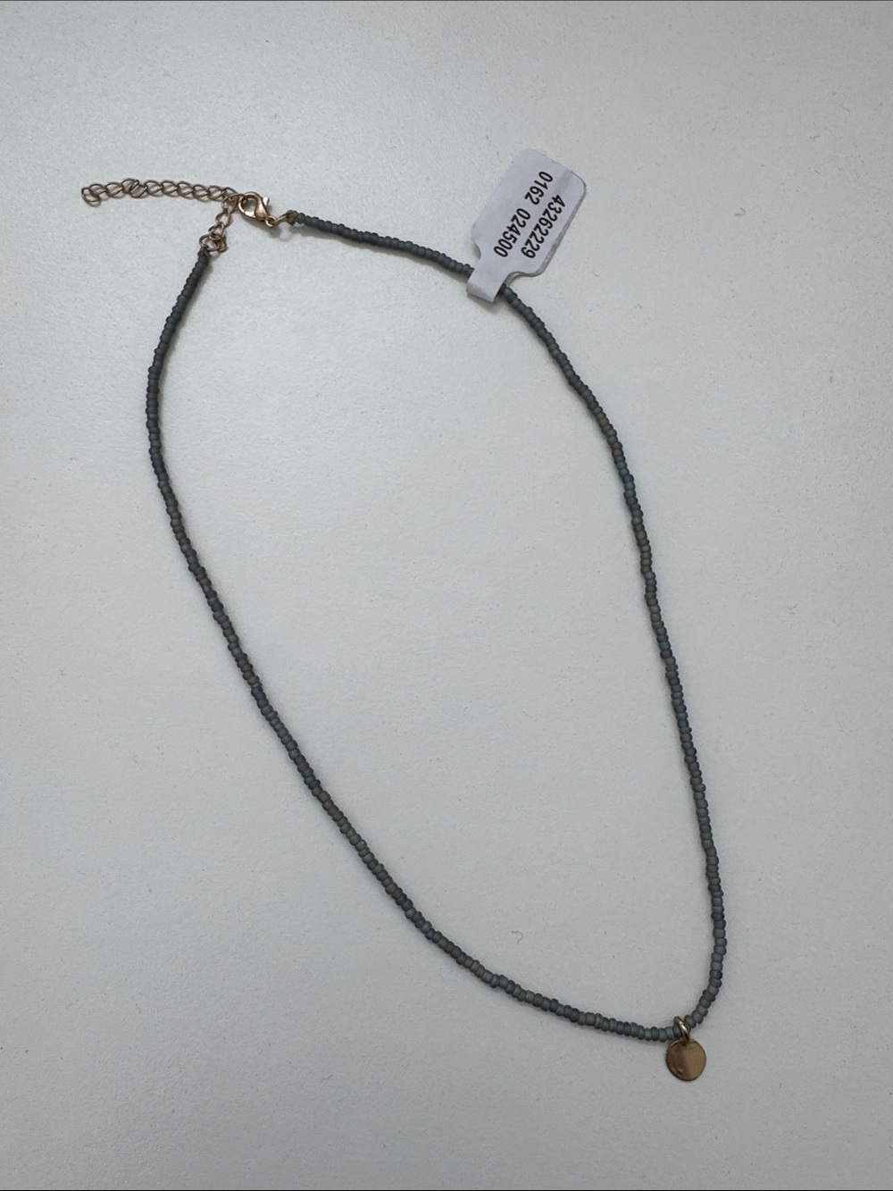 Delicate Blue Gray Beaded Necklace with Gold Disc Pendant